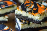 Spooky Halloween Cheesecake Bars with Candy Corn Swirl