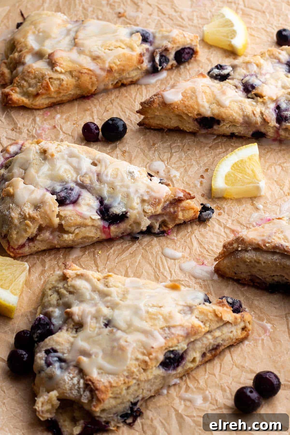 Flaky Sourdough Blueberry Scones Recipe 2 Scones with blueberries, fresh lemons and a lemon glaze.