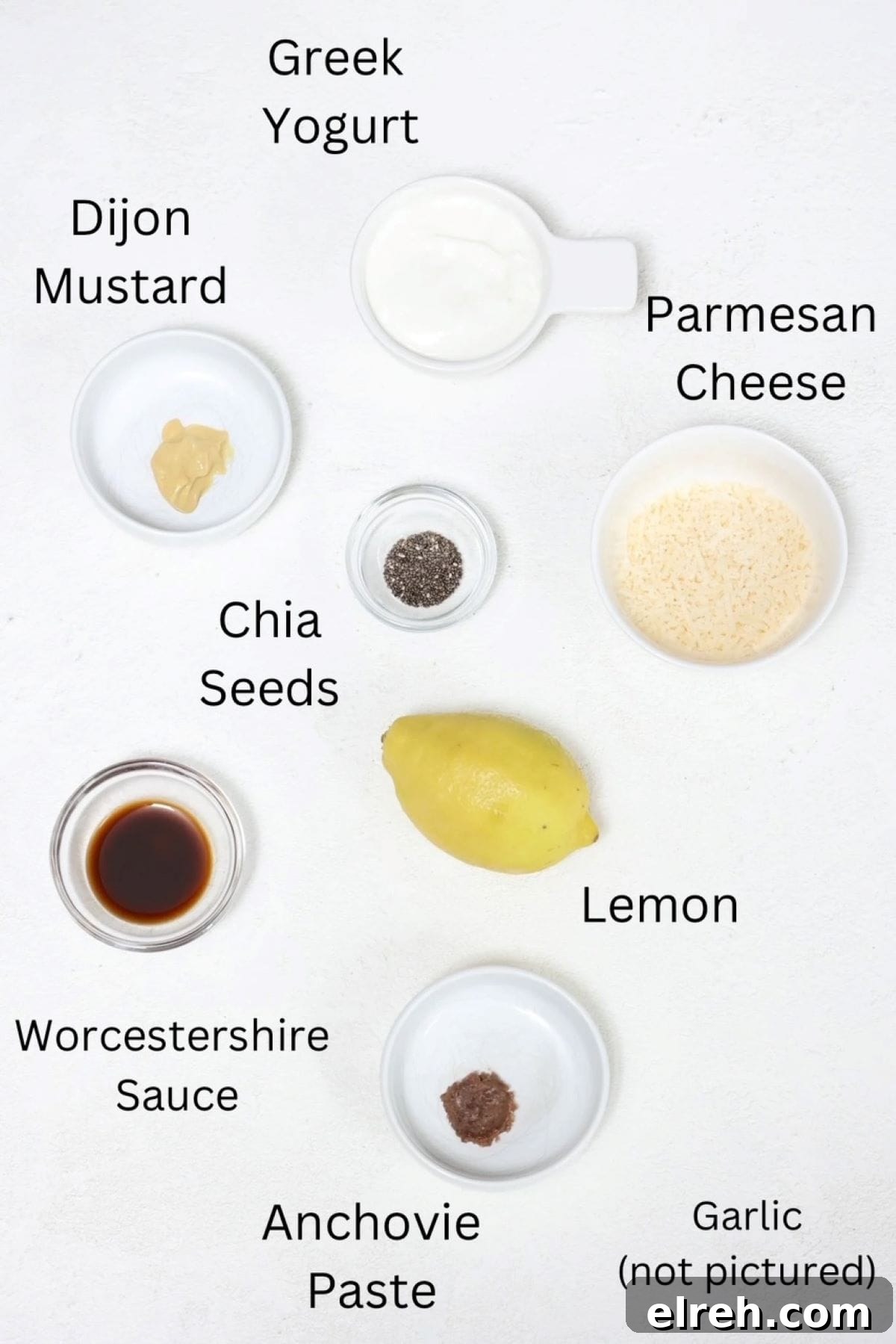 Ingredients for making homemade Caesar dressing, labeled.