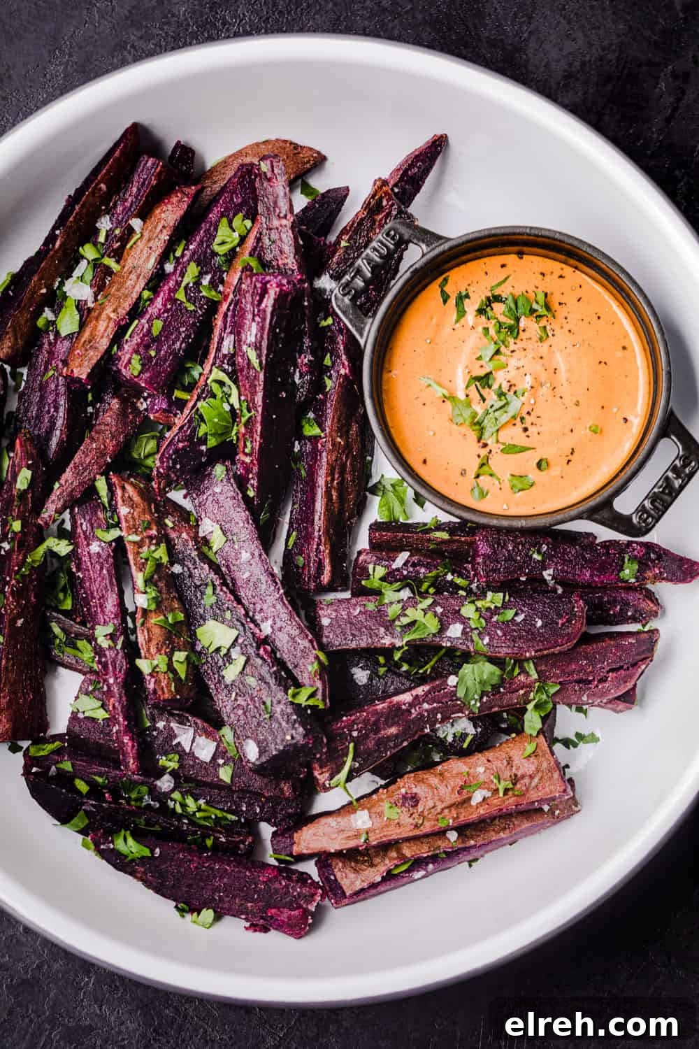 sweet potato fries served on a platter with chipotle aioli