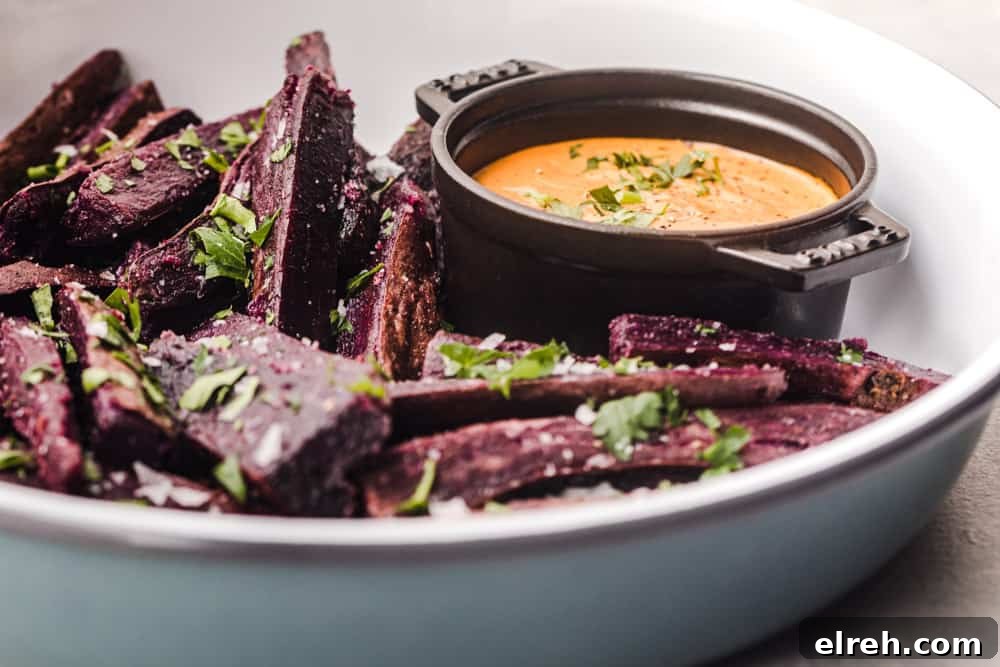 up close and side angle shot of sweet potato fries with chipotle aioli
