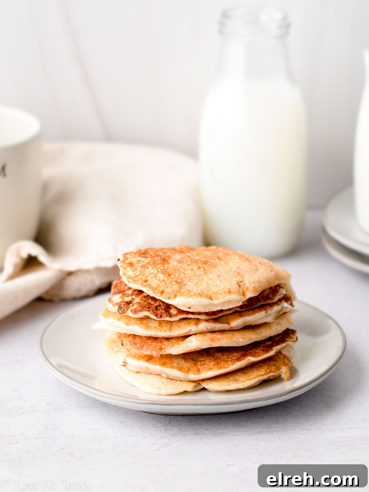 Fluffy Gluten Free Pancakes From Scratch 7 Stack of pancakes on a plate.
