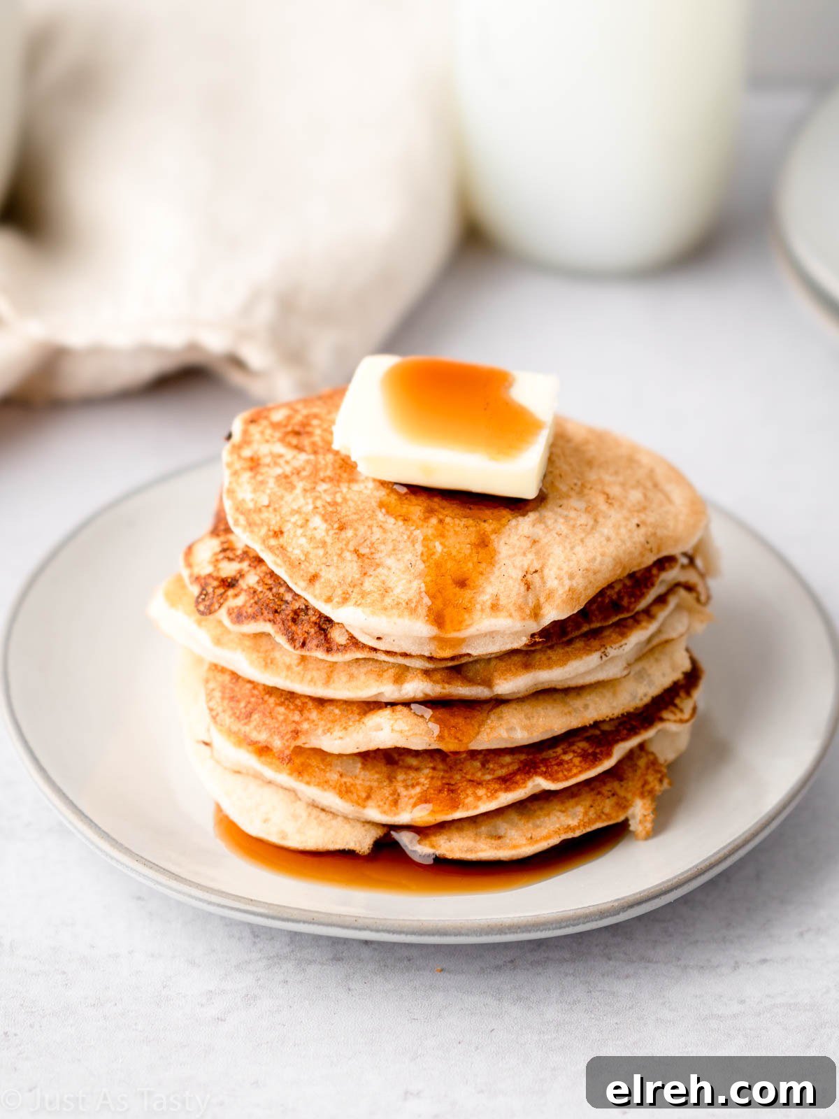 Fluffy Gluten Free Pancakes From Scratch 8 Stack of gluten free pancakes on a plate.