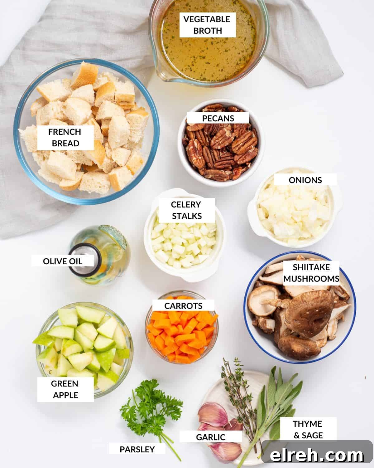 Classic Vegan Stuffing with Herbs and Cranberries 3 Overhead shot of ingredients for vegan stuffing on a white table with labels