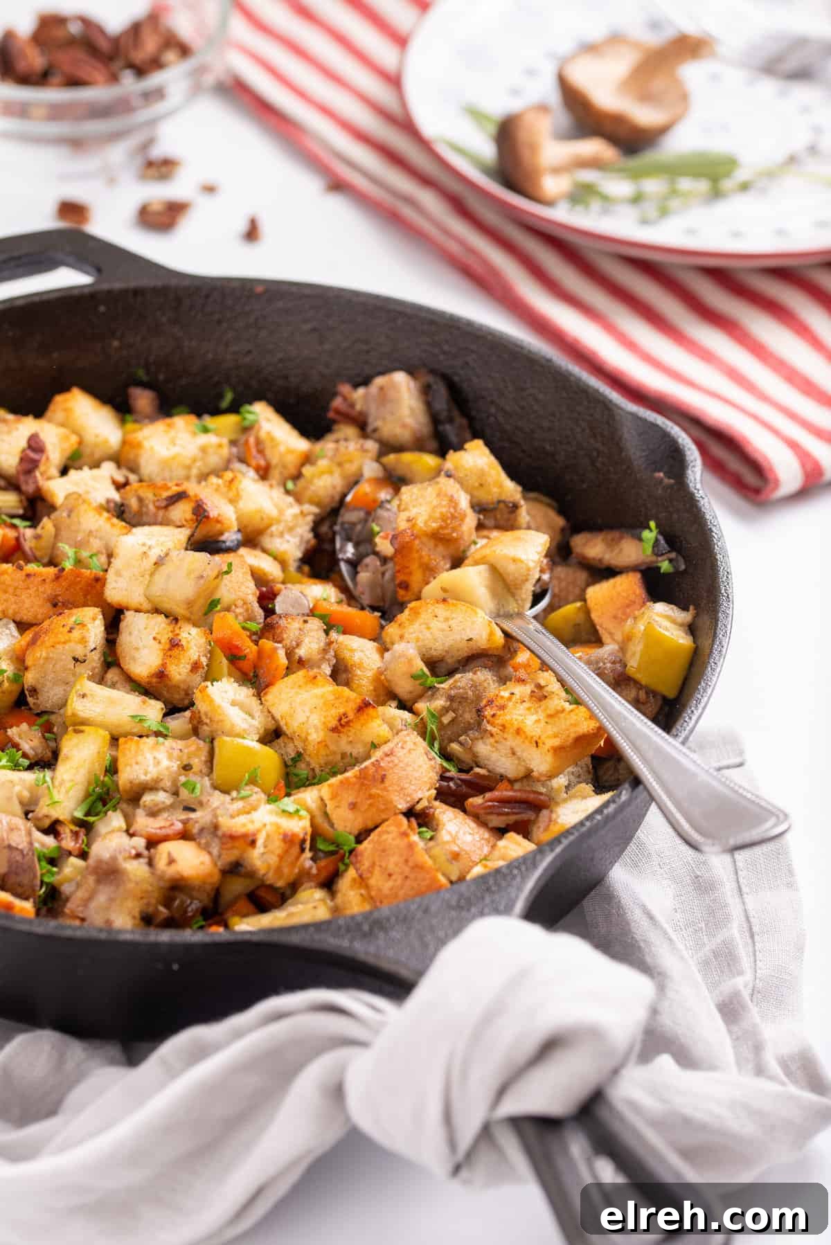 Classic Vegan Stuffing with Herbs and Cranberries 8 Side angle view of skillet with cooked stuffing.