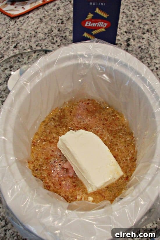Slow Cooker Chicken and Pasta has an amazing sauce made from cream cheese, Italian dressing, and chicken broth.