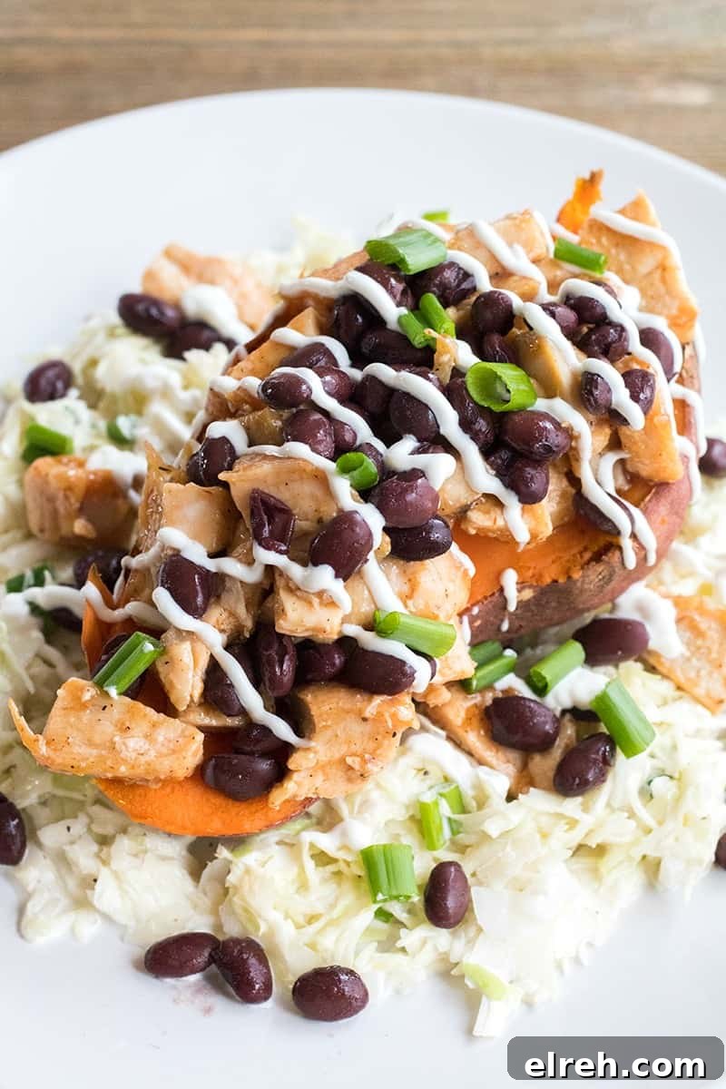 BBQ Chicken Stuffed Yams with Coleslaw is a healthy weeknight dinner that's loaded with flavor and is a sure-fire crowd pleaser!
