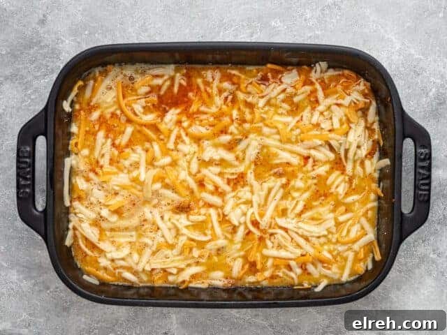 Eggs added to the sausage and cheese, and ready to bake.