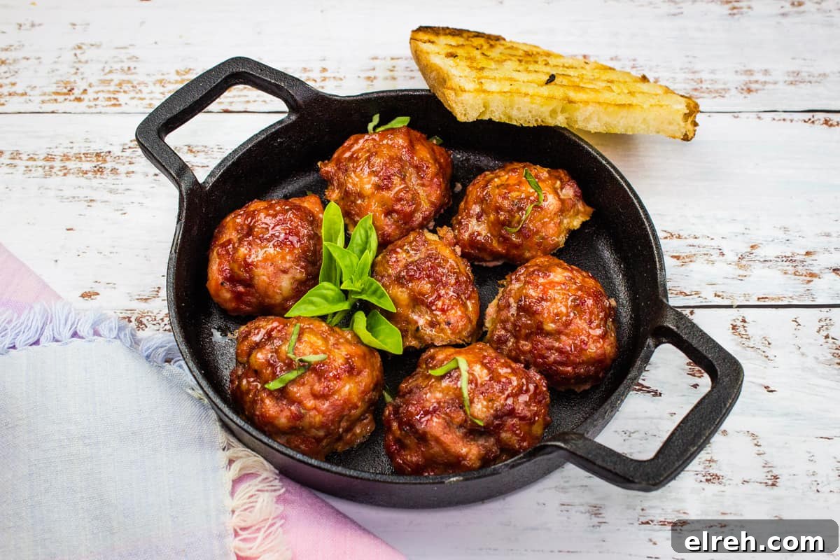 Smoked meatballs in a dish with grilled bread.