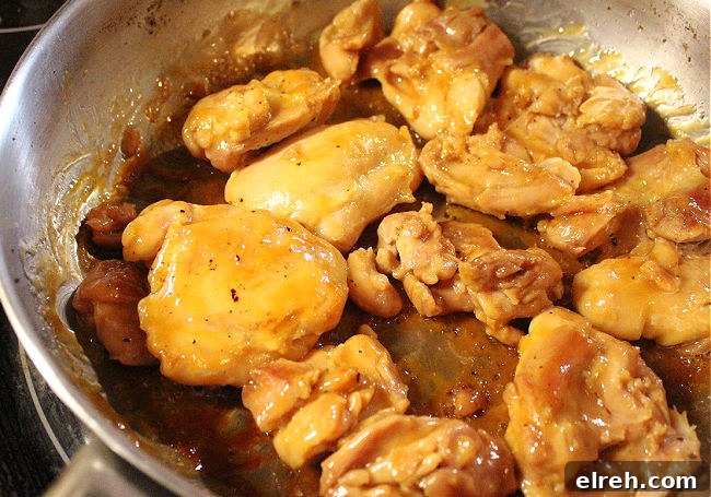 Apple Juice Glazed Chicken Thighs Recipe 9 Cooked chicken in a steel pan.