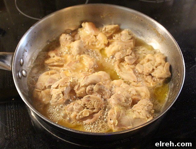 Apple Juice Glazed Chicken Thighs Recipe 8 Chicken thighs in a steel pan.