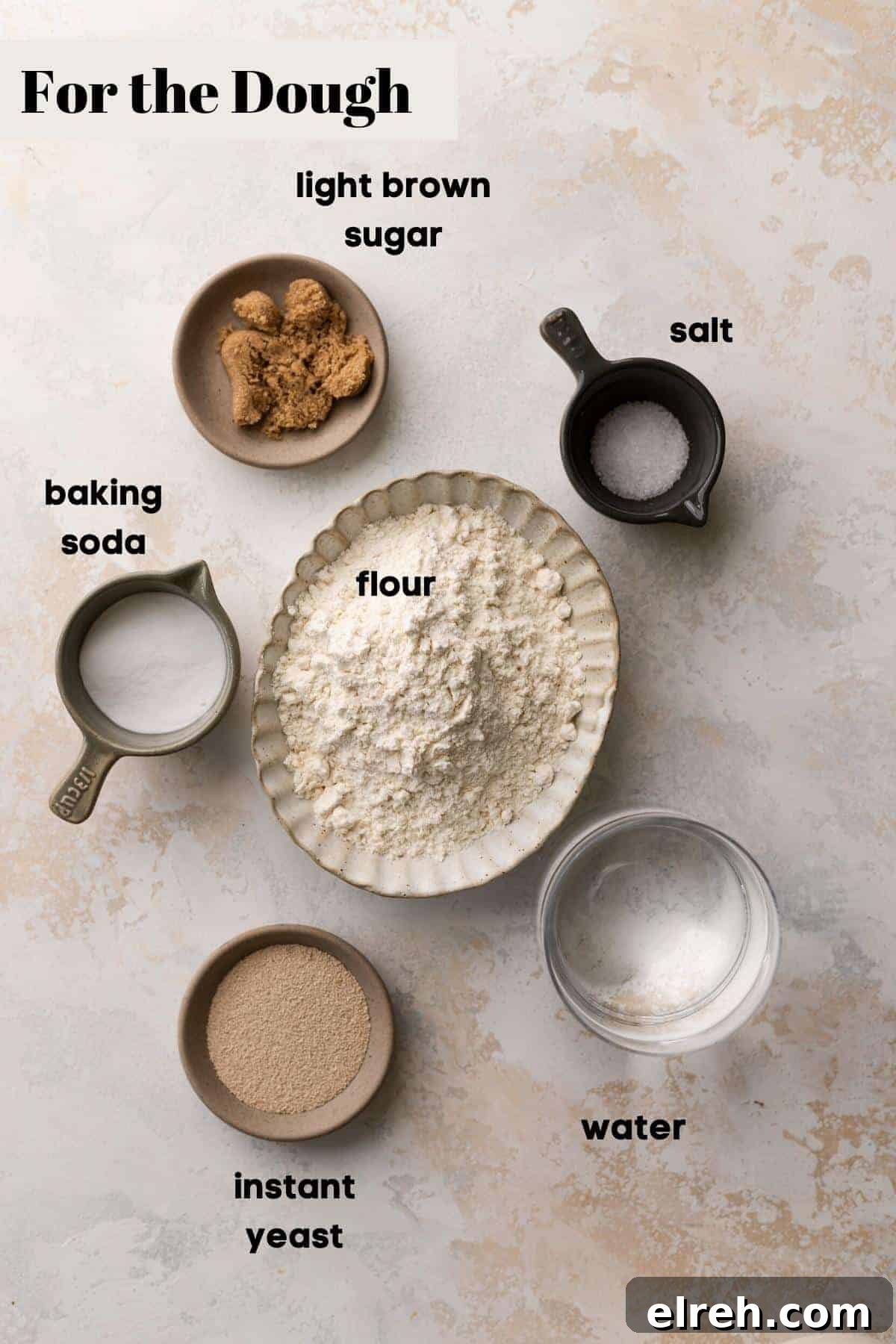 ingredients needed for the soft pretzel dough in bowls.
