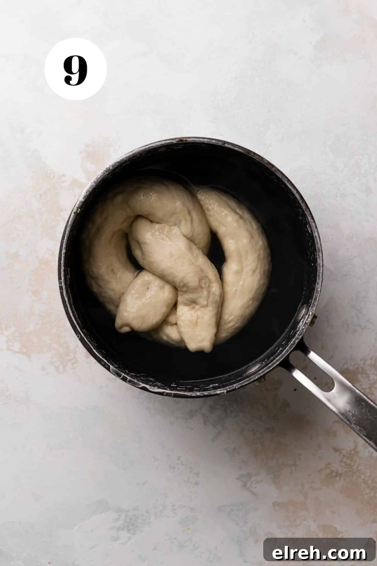 boiling the stuffed pretzel in baking soda water before baking.