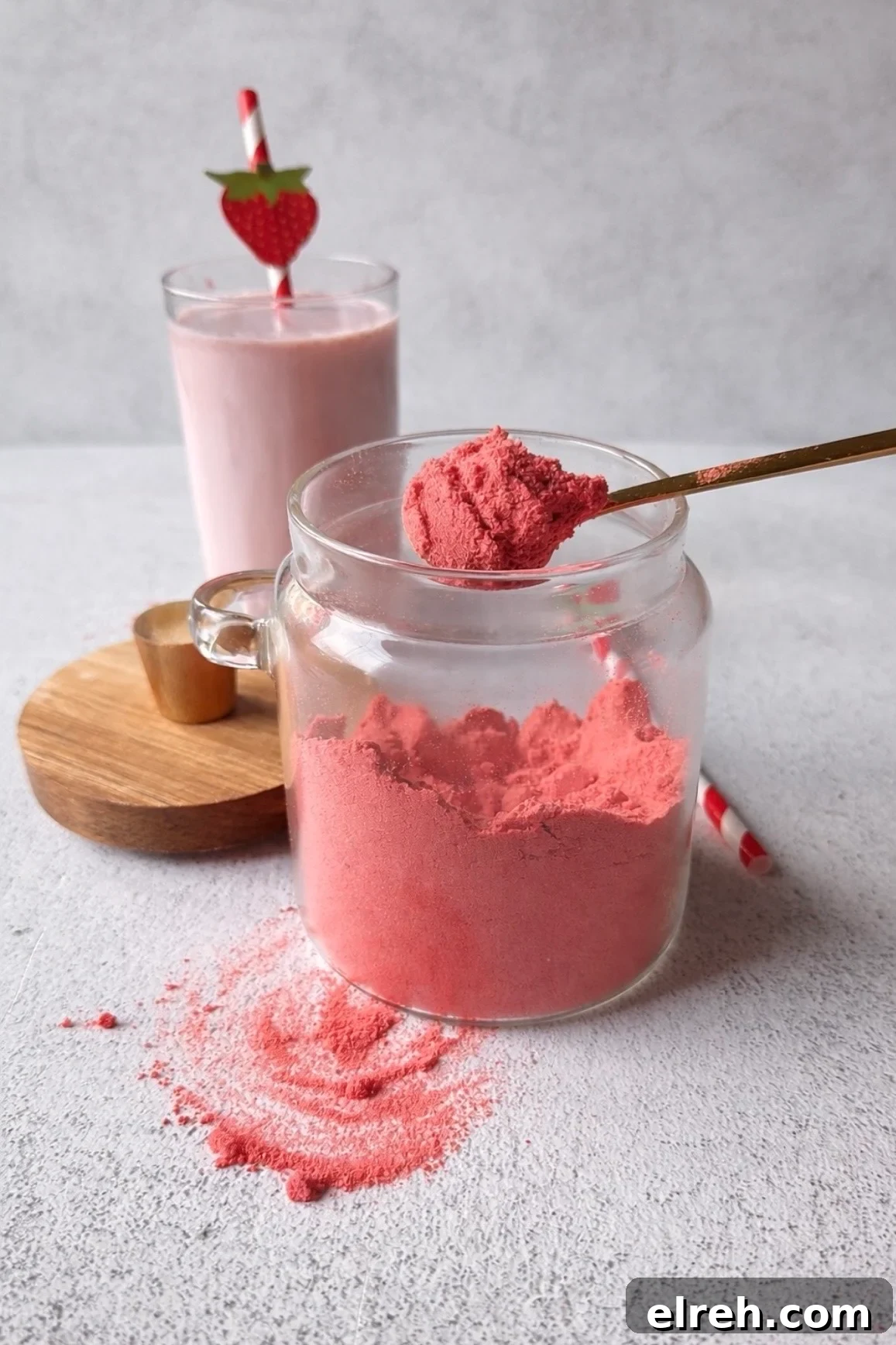 Homemade Strawberry Milk Like Nesquik 2 Strawberry milk powder with a glass of strawberry milk.
