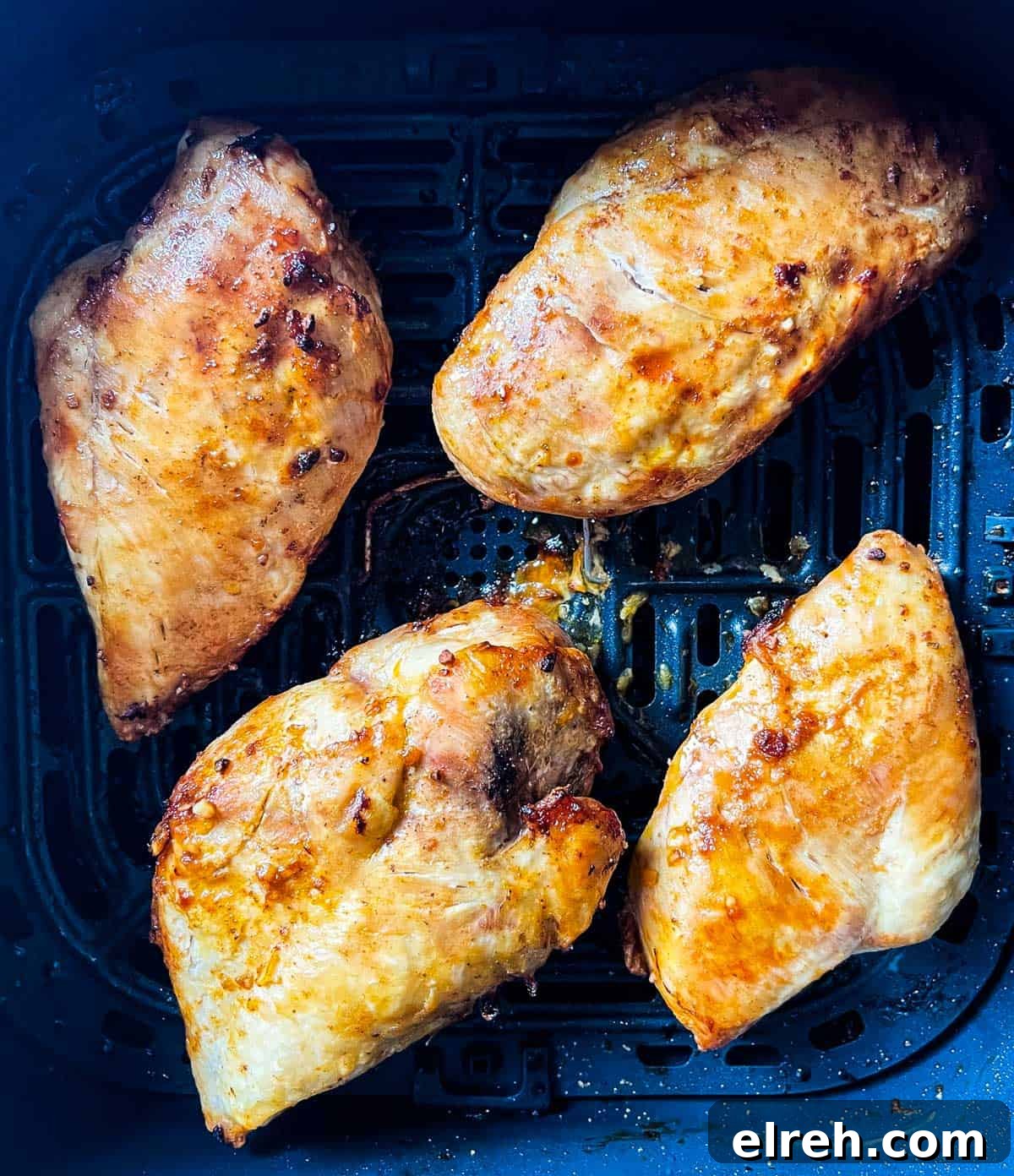 How to Cook Frozen Chicken Breasts in an Air Fryer 8 Air fried chicken breasts in the air fryer basket.