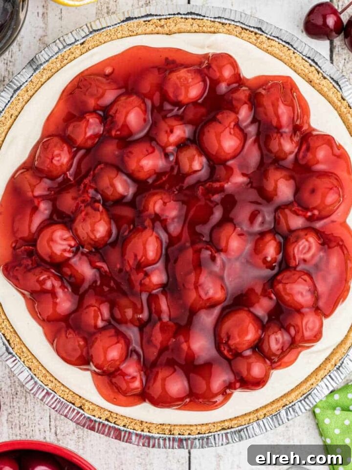 Close up overhead shot of a no bake cherry pie with a graham cracker crust.