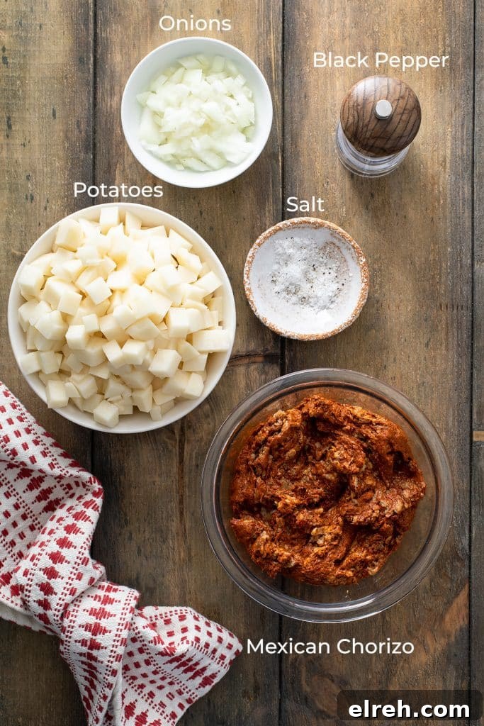 Ingredients to make papas con Mexican chorizo on a wooden table.
