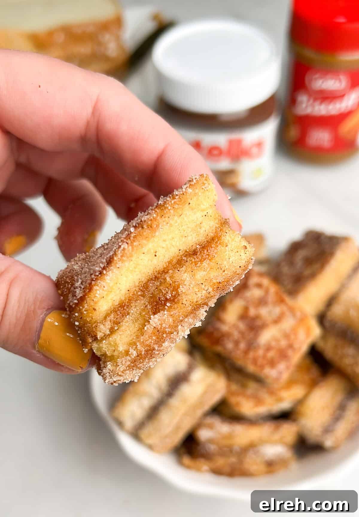 Cream Cheese Stuffed French Toast Bites with Maple Syrup 6 french toast bites in hand