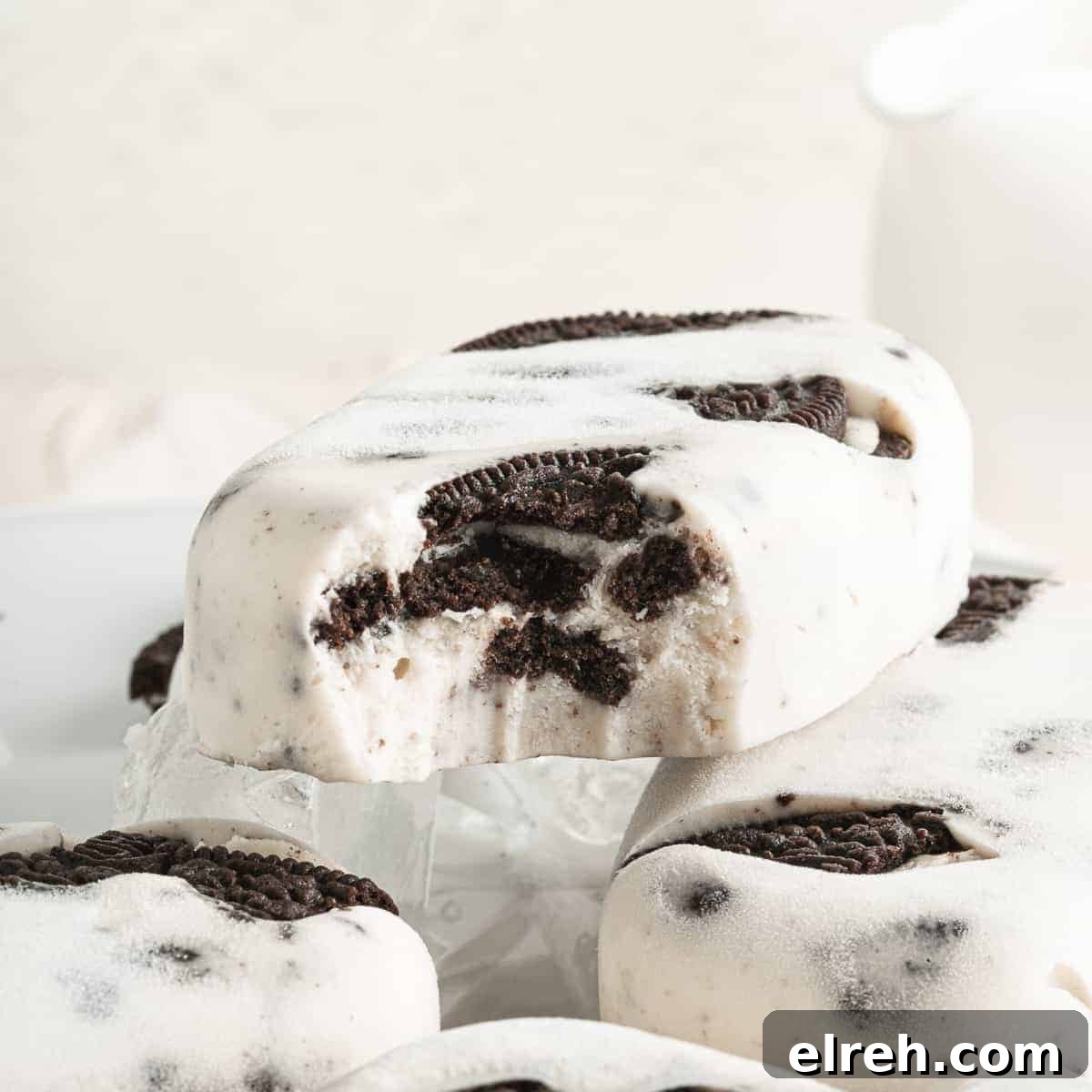 Cookies and cream ice pops with pieces of OREO cookies inside.