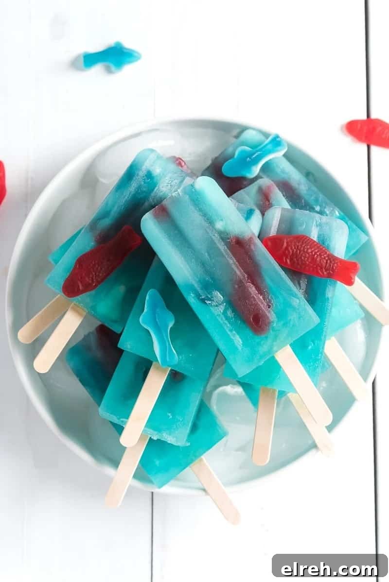 Blue lemonade popsicles with gummy fish.