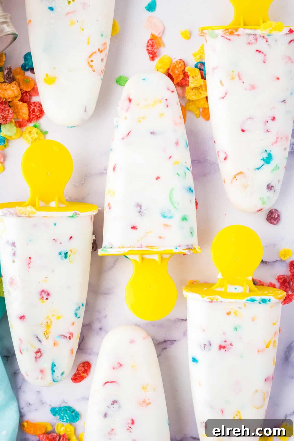 Fruity Pebbles popsicles with cereal visible.