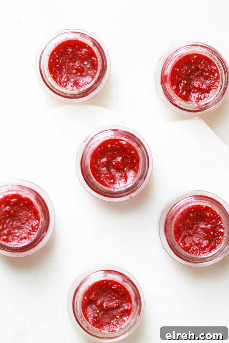 glass lip balm containers filled with homemade strawberry lip balm