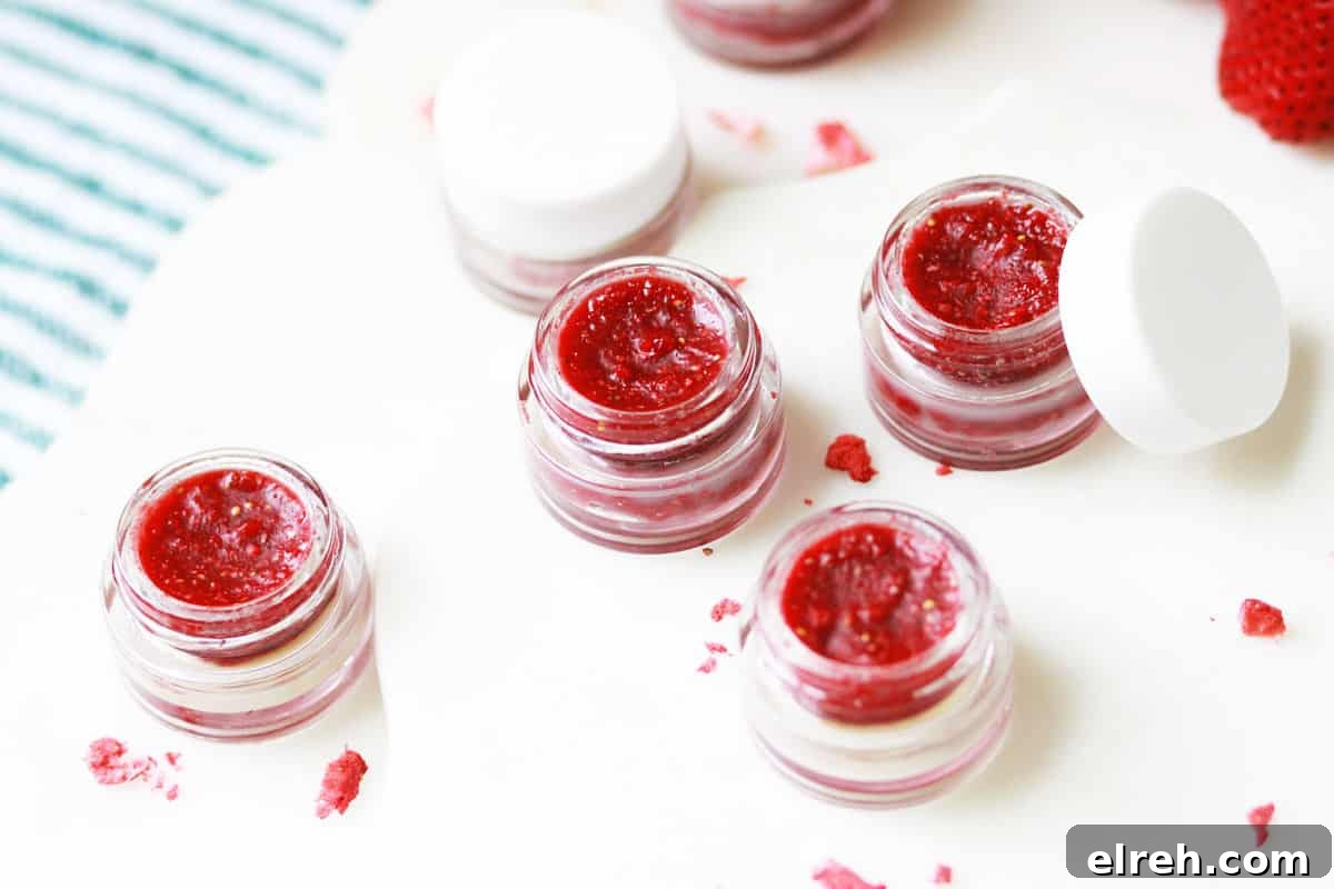 glass lip balm containers filled with homemade strawberry lip balm