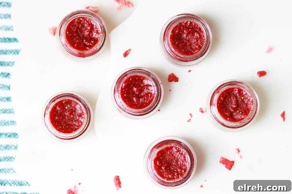 glass lip balm containers filled with homemade strawberry lip balm