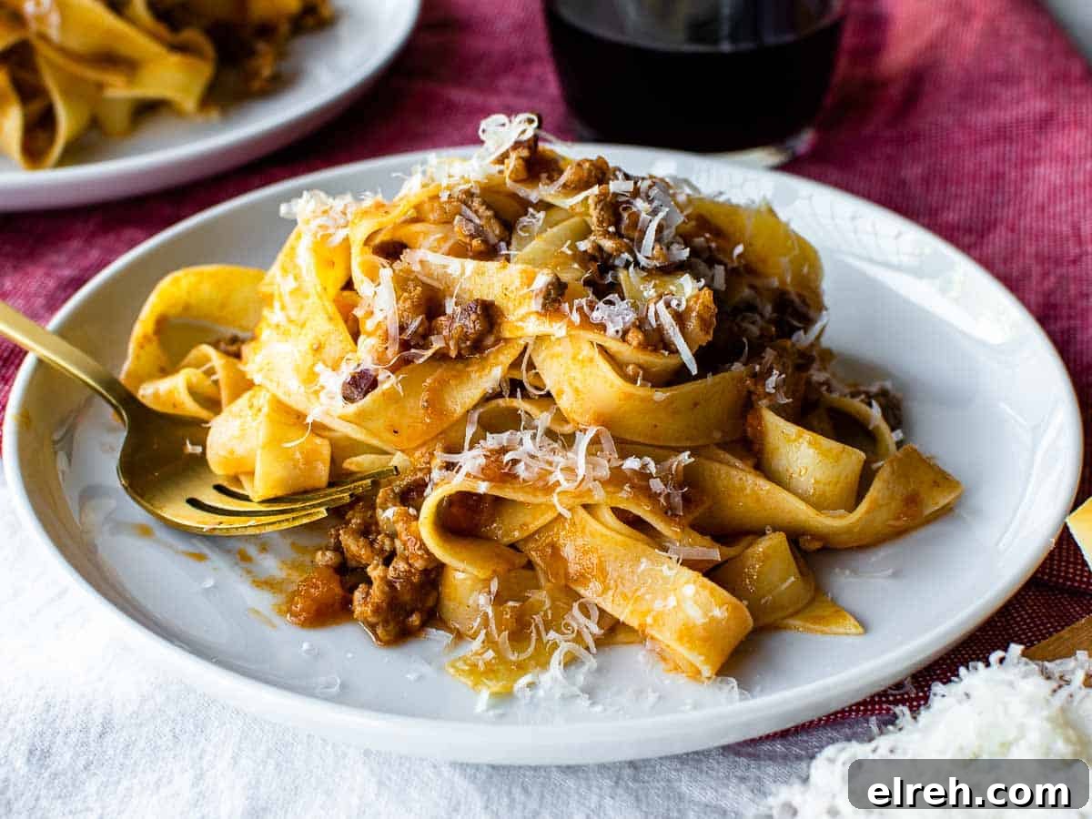Authentic Tagliatelle with Bolognese Sauce Recipe 11 Close up of white plate with pasta on.