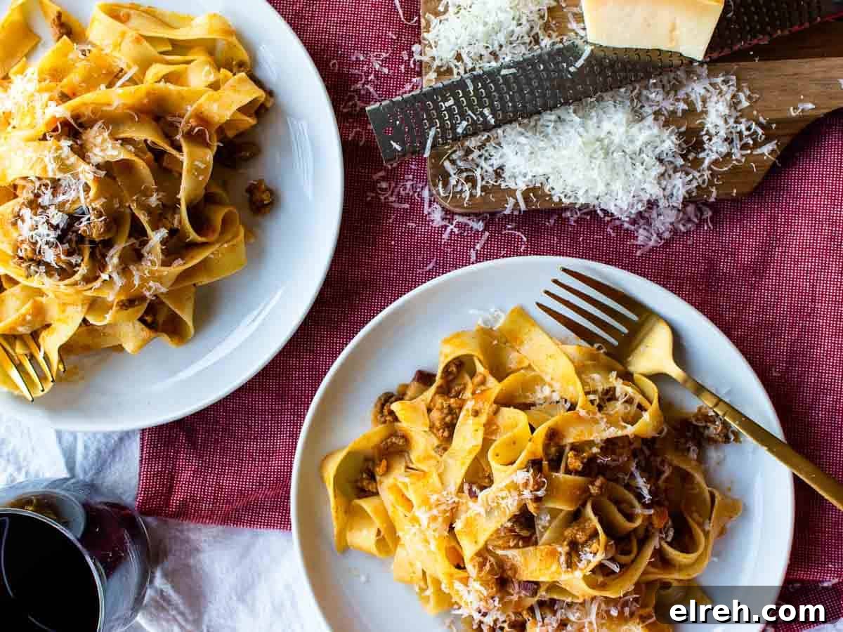 Authentic Tagliatelle with Bolognese Sauce Recipe 10 Overhead view of two plates of pasta.