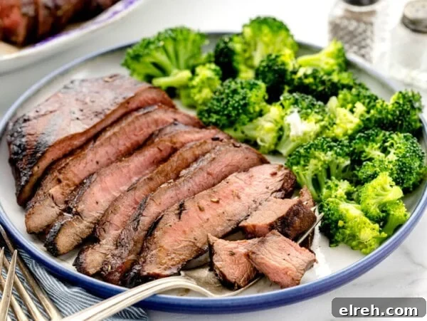 Easy steak marinade flavored steak sliced and served with broccoli.