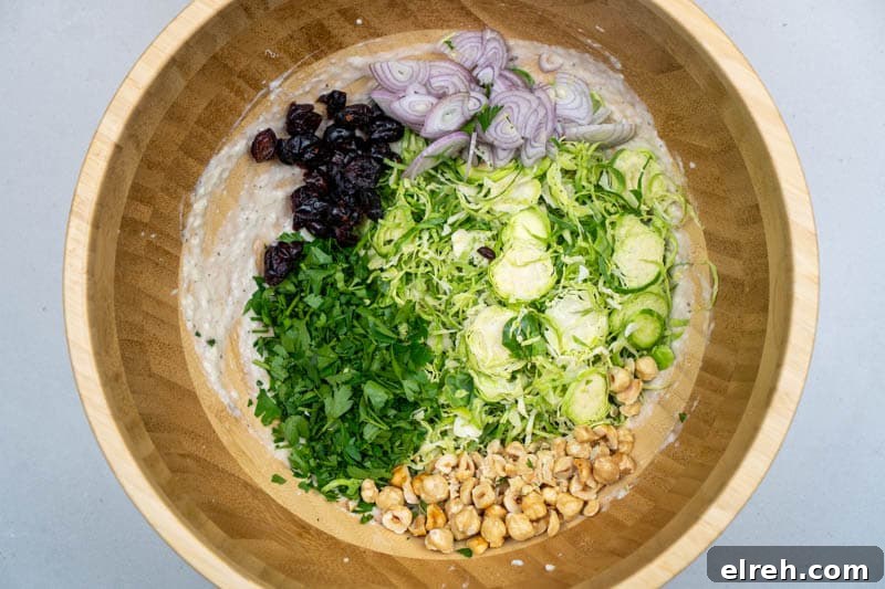 Shaved Brussels Sprouts Salad with Cranberries and Hazelnuts 5 Adding the ingredients to the bowl