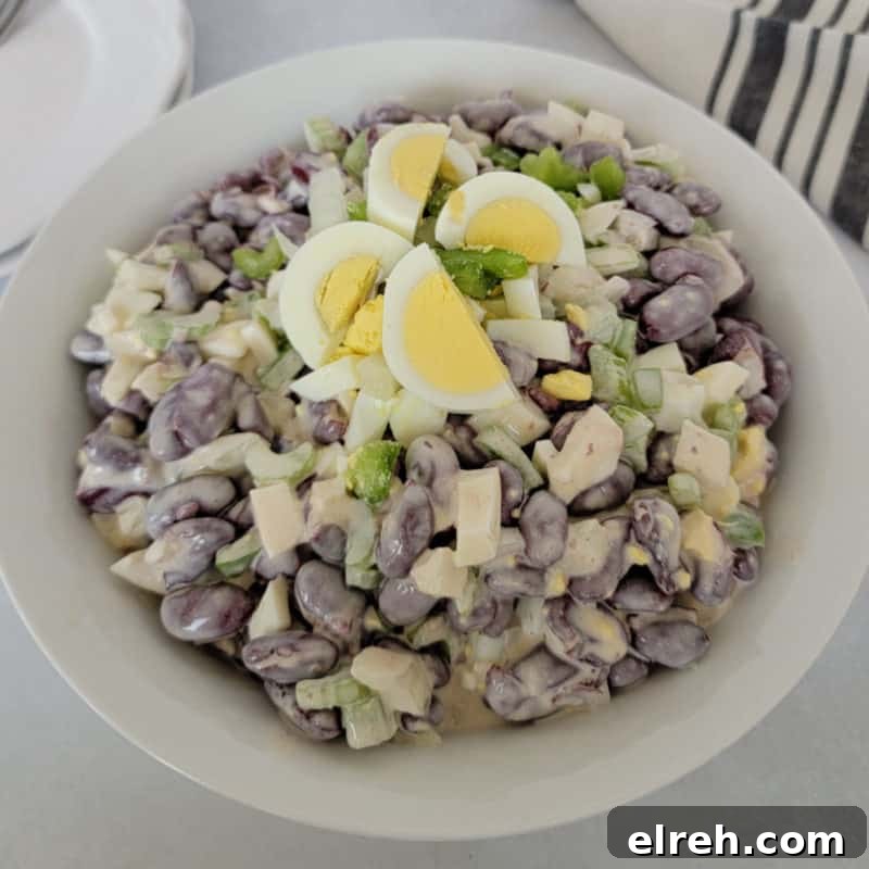 Celery Recipes Fresh Ideas for What to Make with Celery 12 Kidney Bean Salad with hard boiled egg pieces on top in a white bowl