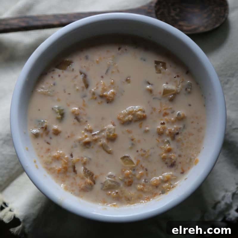 Celery Recipes Fresh Ideas for What to Make with Celery 8 Sweet Potato Stew in a white bowl with a wooden spoon