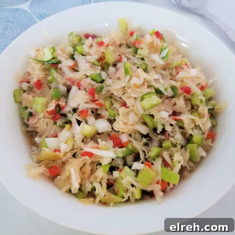 Celery Recipes Fresh Ideas for What to Make with Celery 10 Sauerkraut Salad in a white bowl next to a fork