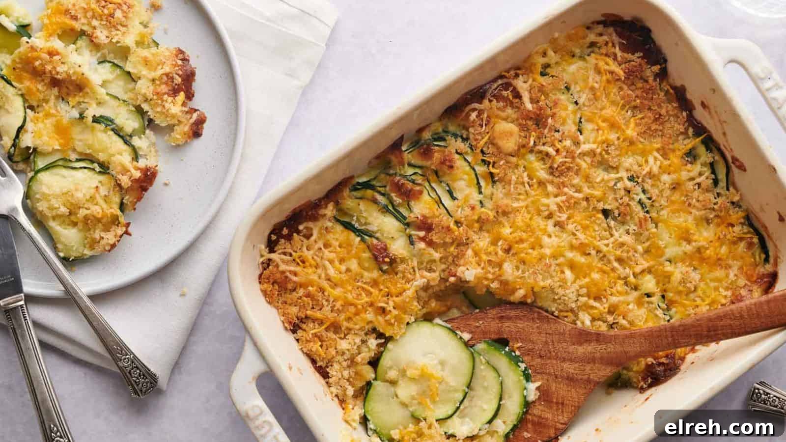 A casserole dish with zucchini and cheese on it.