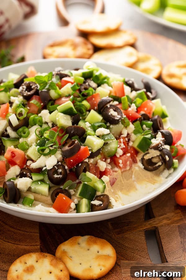 Greek Layered Dip in white ceramic dish