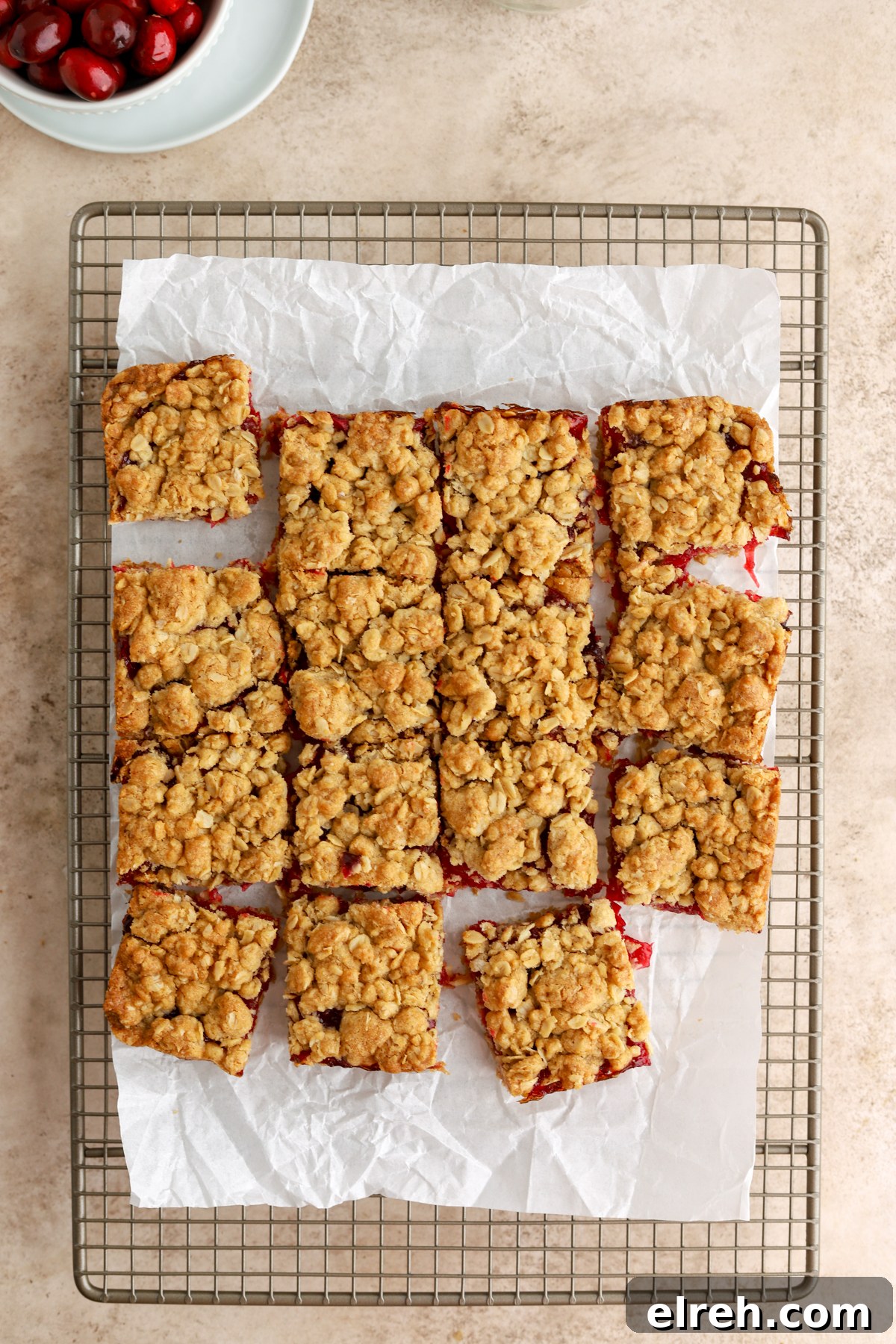 Tangy Cranberry Lemon Bars with Shortbread Crust 3 Cranberry lemon bars on a plate.