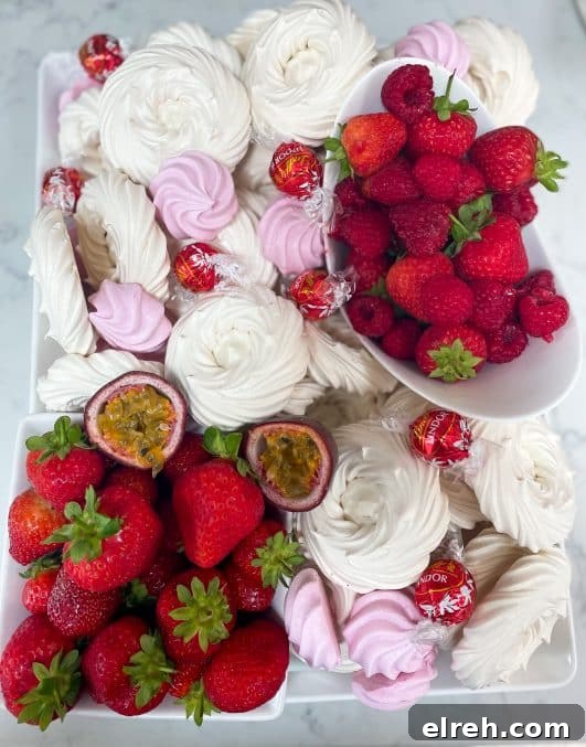 Meringues, strawberries, raspberries grazing board