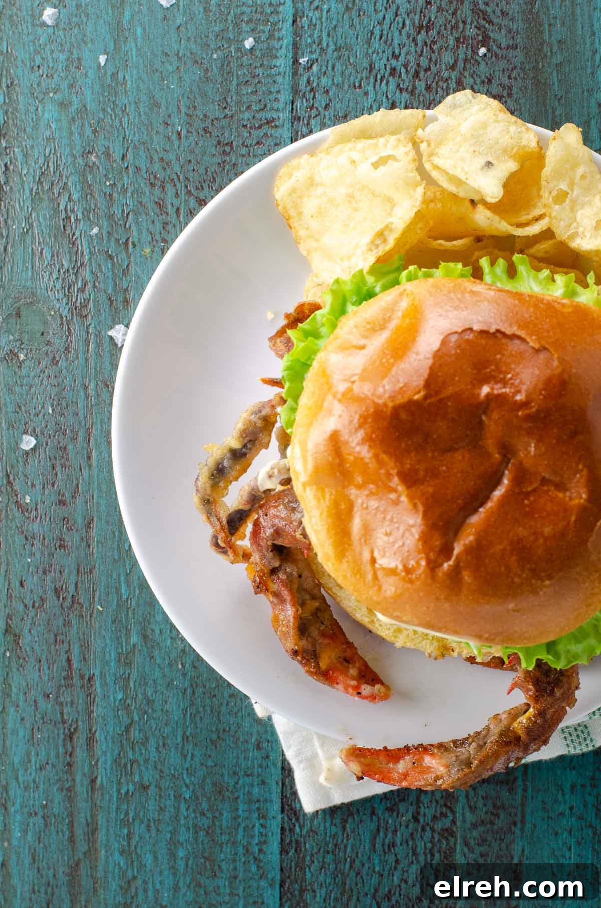 Soft-Shell Crab Sandwich Recipe: Crispy with Lemon Aioli 5 soft shell crab sandwich with lettuce, tomato, and mayo on a brioche bun