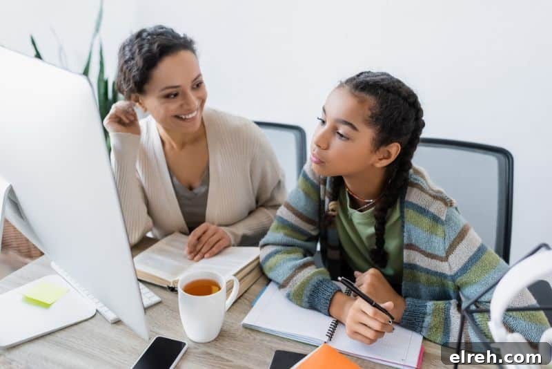mom helping teenage daughter study