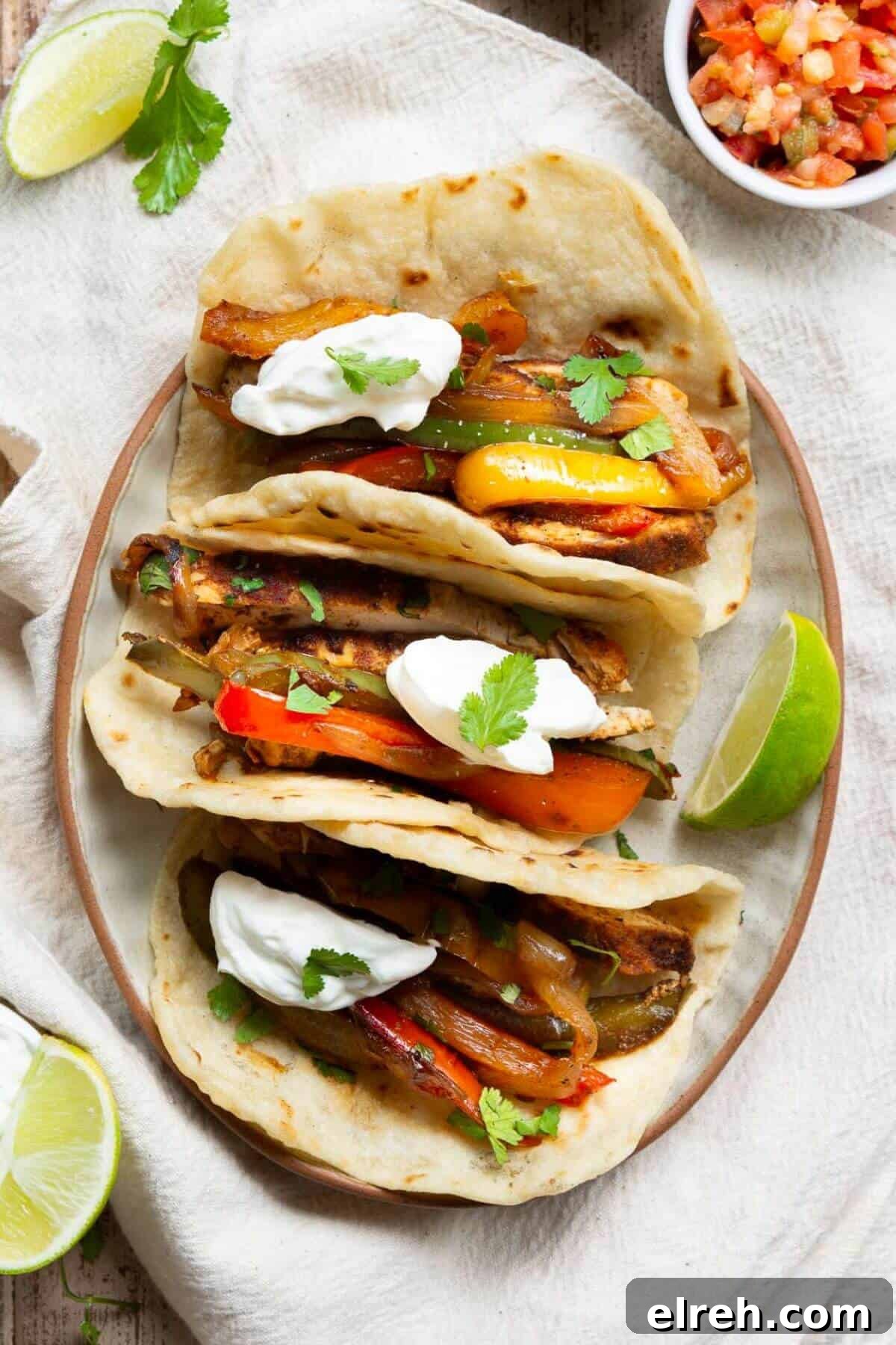 Chicken Fajita Tacos with Grilled Peppers and Onions 11 Easy chicken fajita taco with charred peppers and sour cream.