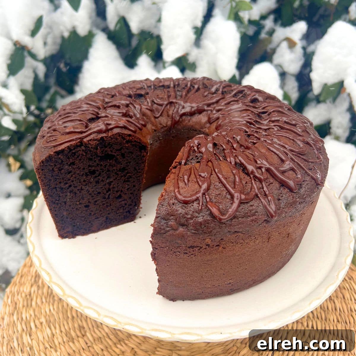 Chocolate Brownie Bundt Cake Recipe 6 Brownie Bundt Cake, Sliced, on a cake pedestal.