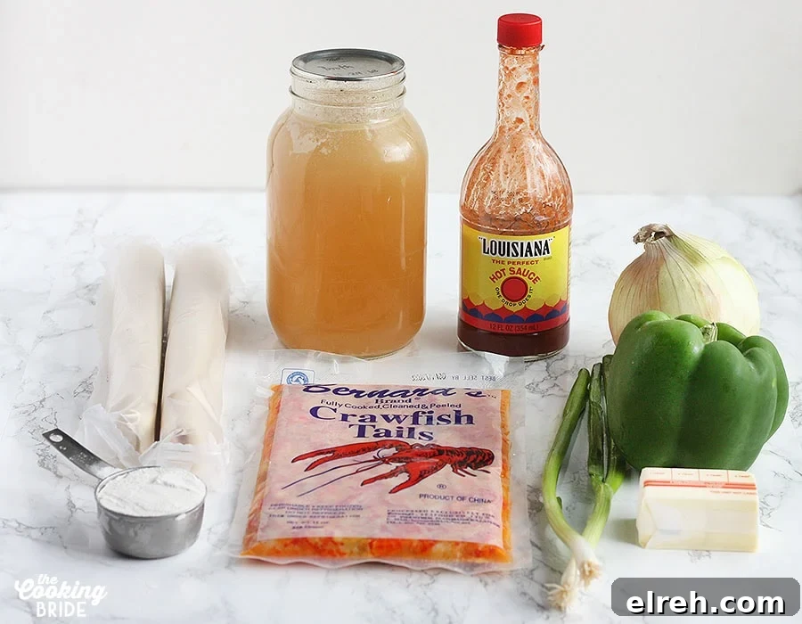 crawfish pie ingredients inclduing flour, pie crusts, stock, hot suace, green onion, butter, green bell pepper and onion