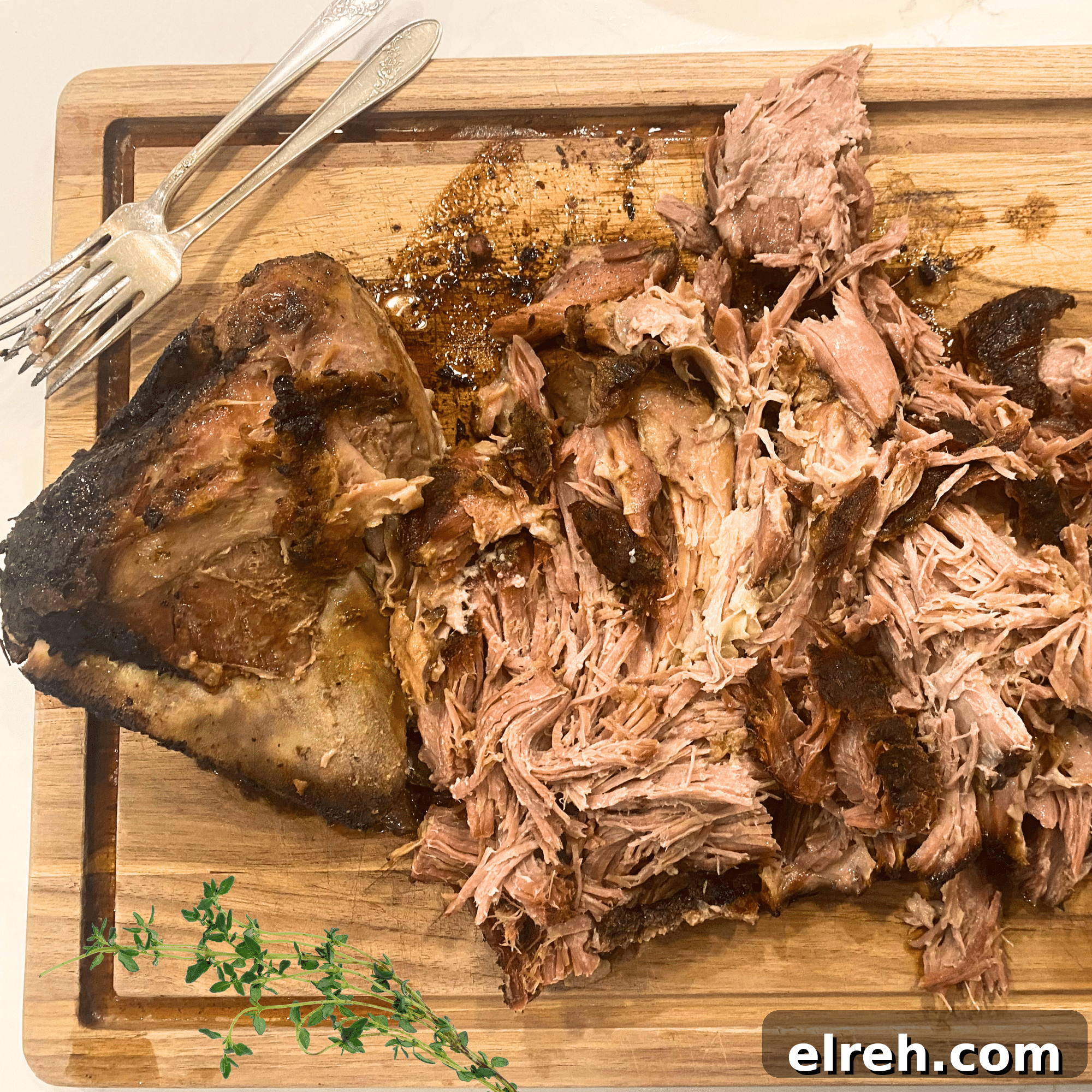 Boston butt roast recipe shredded on cutting board fully cooked
