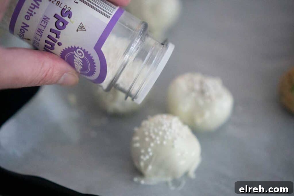 3 Ingredient Sugar Cookie Truffles 7 adding white prinkles to white chocolate truffle