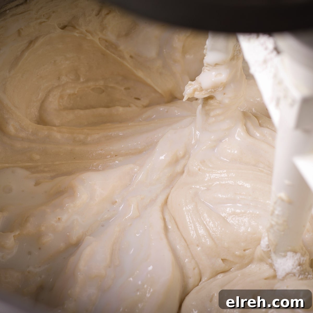 Raspberry Cupcakes Recipe with Cream Cheese Frosting 15 Slowly mixing buttermilk into the cupcake batter.