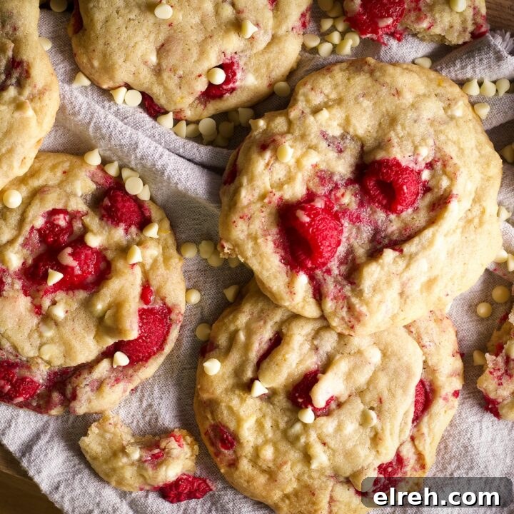 A tray filled with white chocolate raspberry cookies.