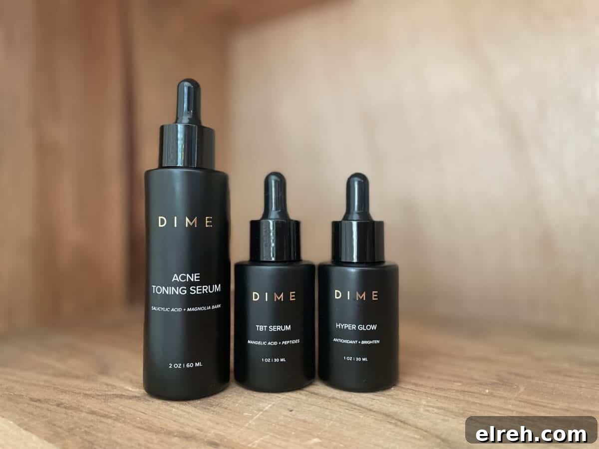 3 black bottles of dime products sitting on a shelf