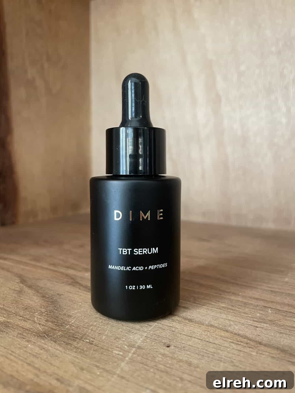 a closed black jar of dime tbt serum sitting on a shelf
